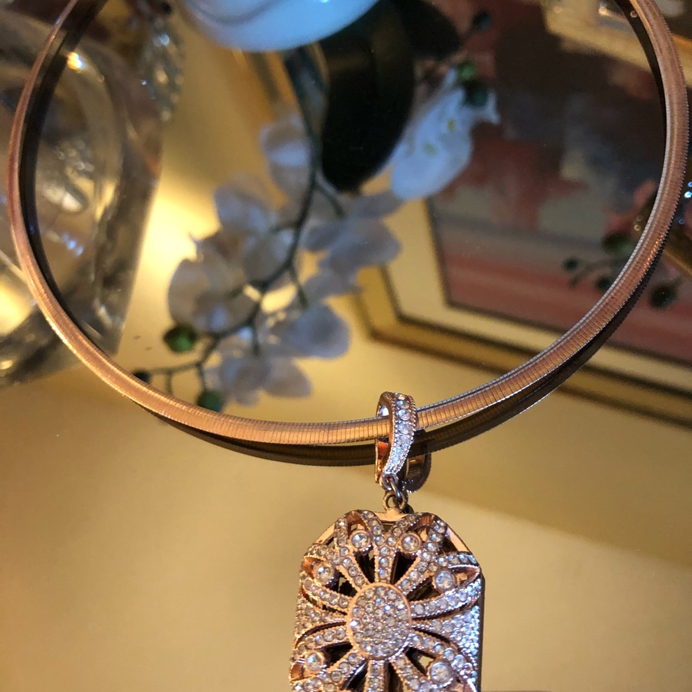 - rose gold color on omega with hanging cz pendan
